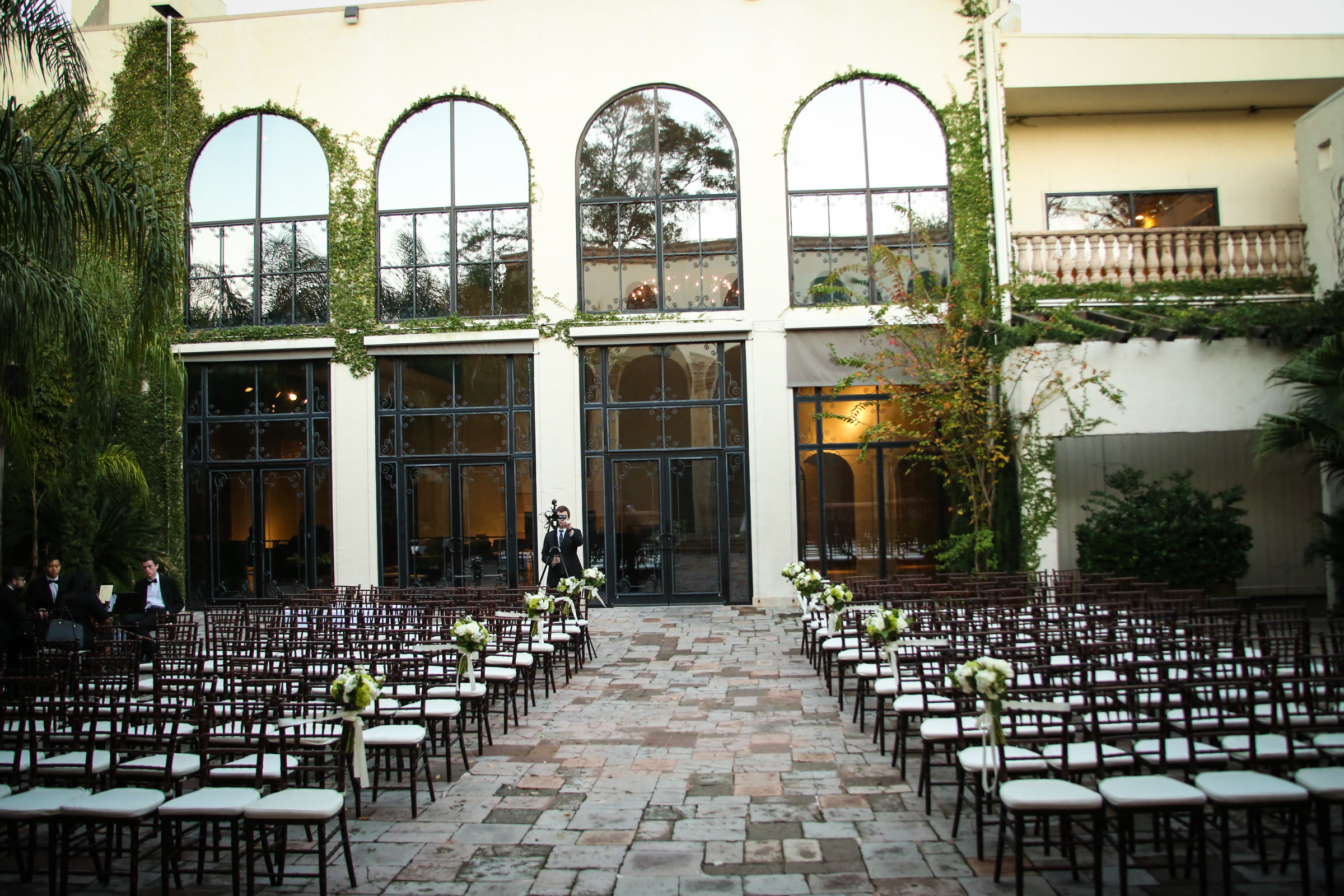 Grand arched courtyard at The Bell Tower on 34th in daylight